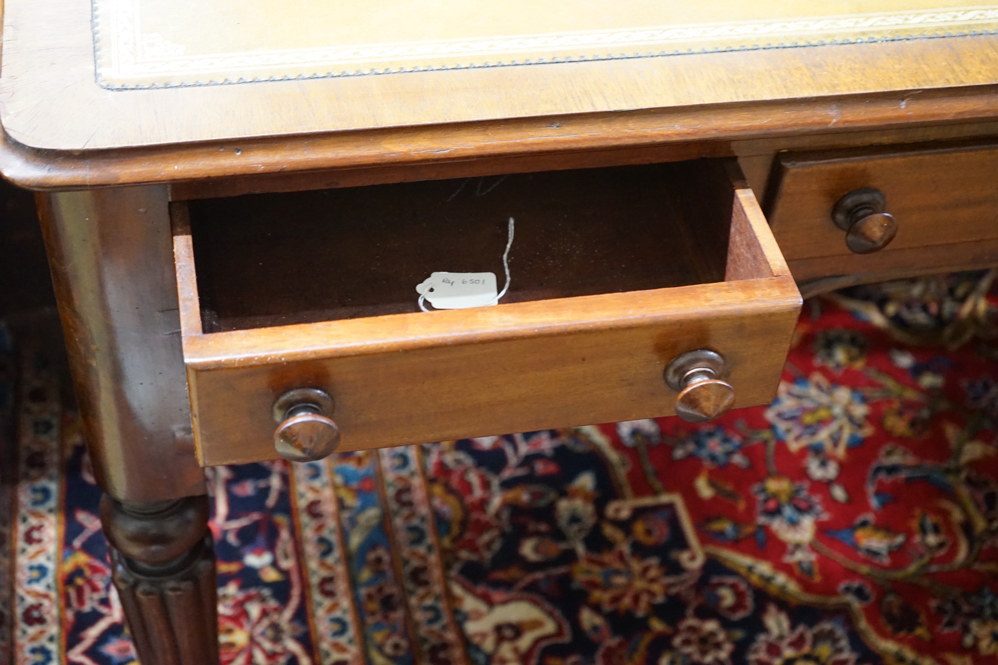 A Victorian mahogany kneehole writing table, width 119cm, depth 55cm, height 74cm